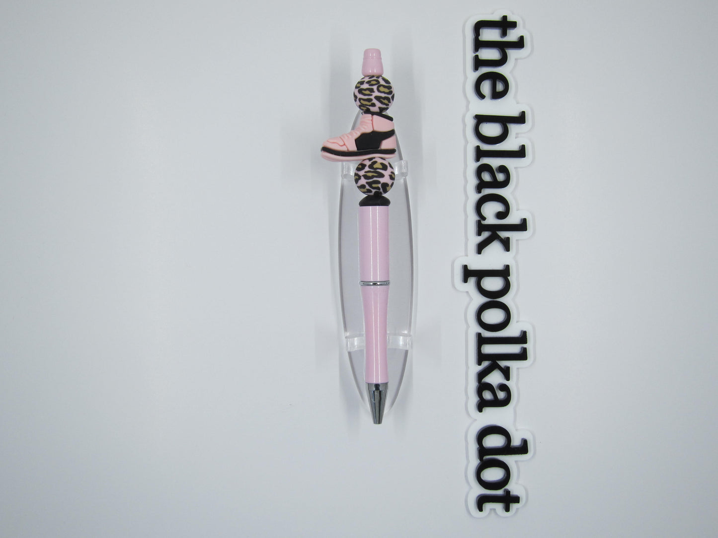 pink and black sneaker