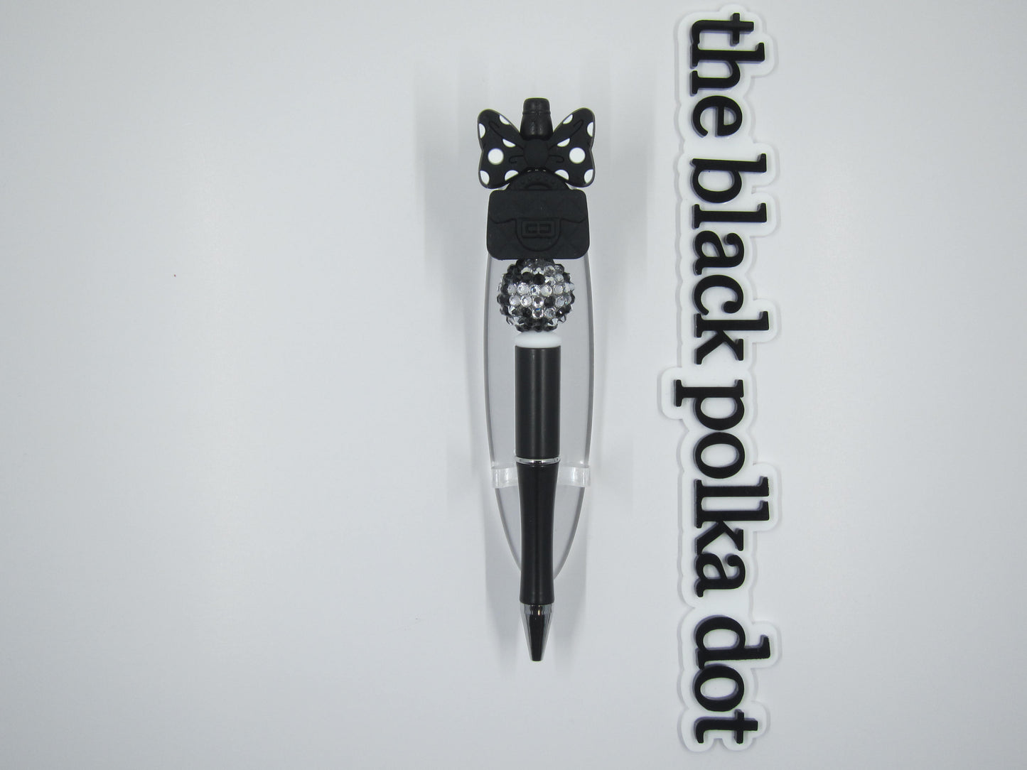 white polka dot bow and purse